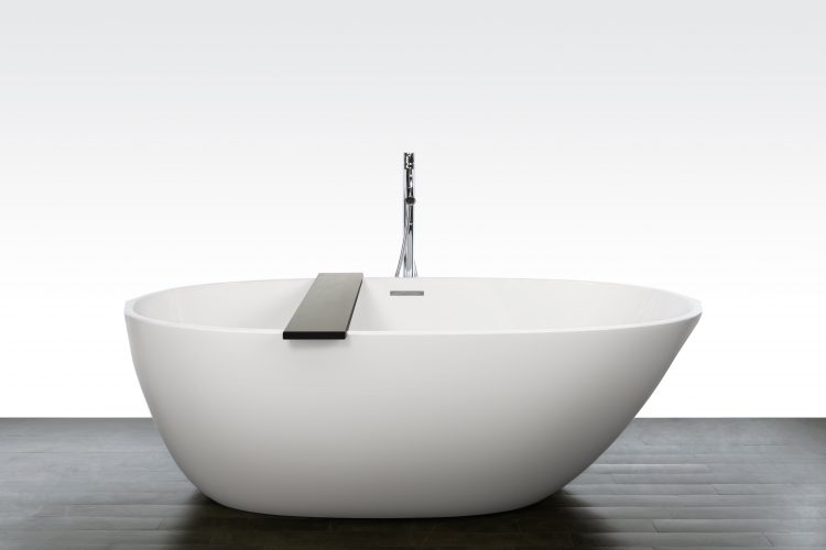 Luxury freestanding white bathtub with wooden shelf